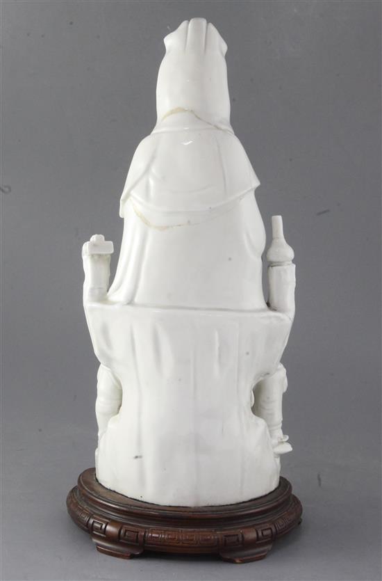 A Chinese Dehua blanc de chine group of Guanyin with child and attendants, 17th/18th century 36cm, height 40cm including wood stand